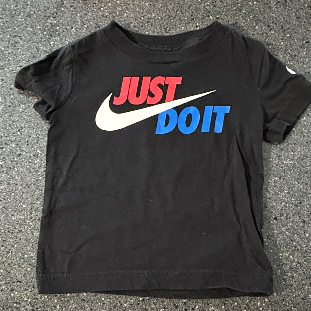 Nike Kids Black Tee with Red, White, and Blue Slogan